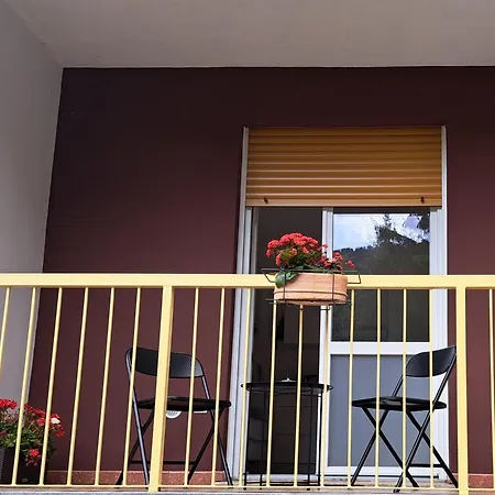 Dinky's With A Balcony Overlooking The Woods Daire Magreglio